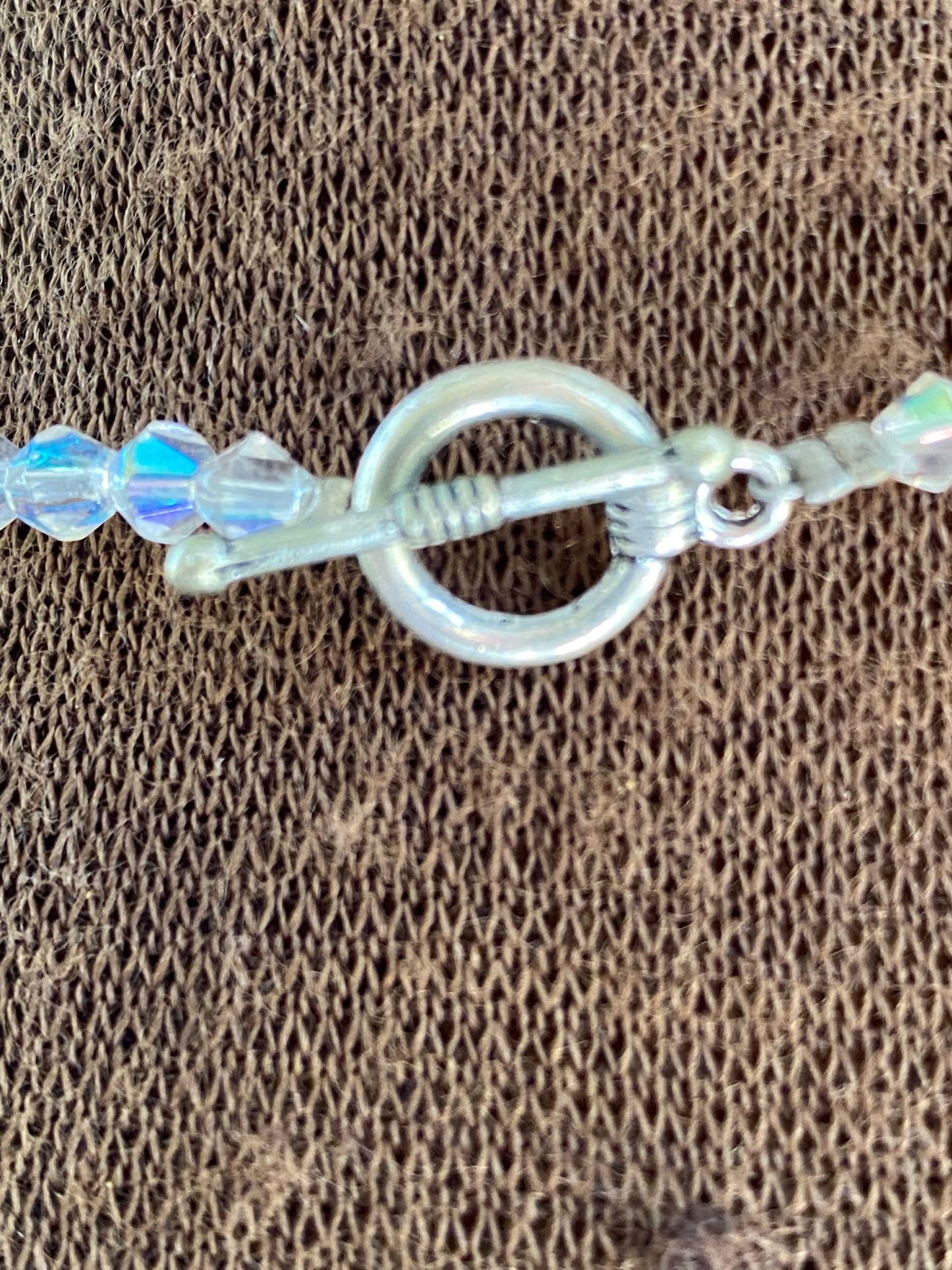 Easy to fasten metal toggle clasp fastening.